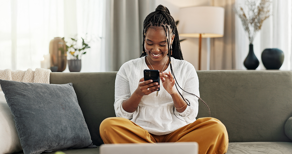 girl on sofa with phone